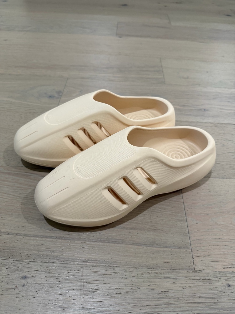 adidas adiFOM IIInfinity Mule is an off-white, slip-on foam clog